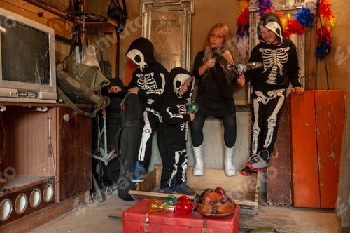 Preview: Cute Children In Carnival Costumes, Boys With Girl In The Garage. Black Suit With The Image Of