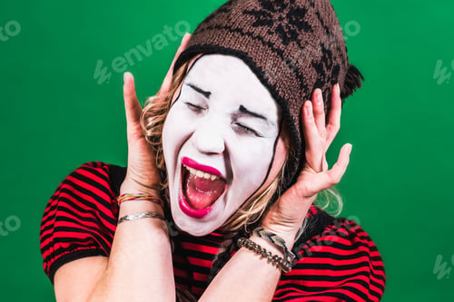 Preview: Cheerful Mime Girl Posing And Grimacing In Photo Studio