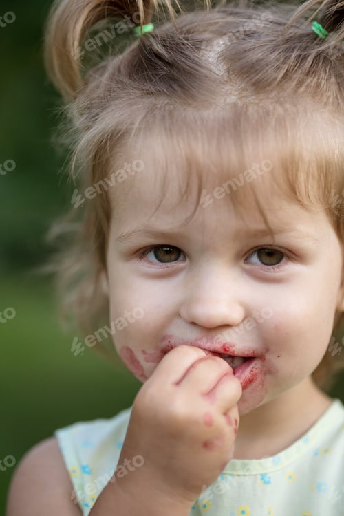 Preview: The Little Girl Eats Cherry In The Garden. Summer
