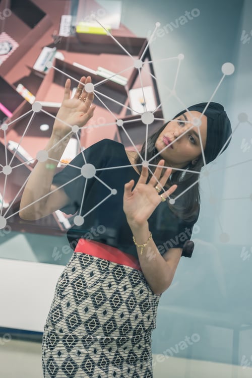 Preview: Beautiful Young Brunette With Turban Working On A Virtual Screen