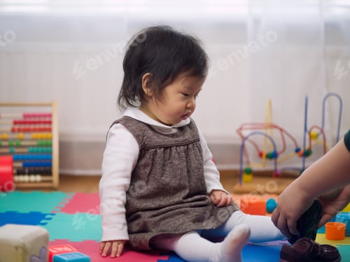 Preview: Cute Smiling Baby Girl Play Toy At Home