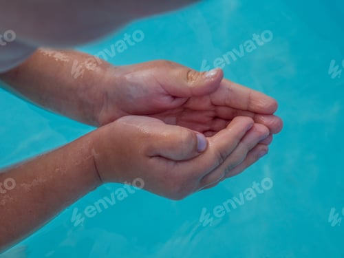 Preview: Hands Close Up. Little Blonde Boy In Hot Summer Day Swim In Carcas Pool In Swimwear For Boys