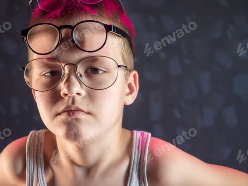 Preview: Photo Of Funny Boy, Blonde Kid With Lot Of Pairs Of Glasses On His Face. Child Is Happy At Home On