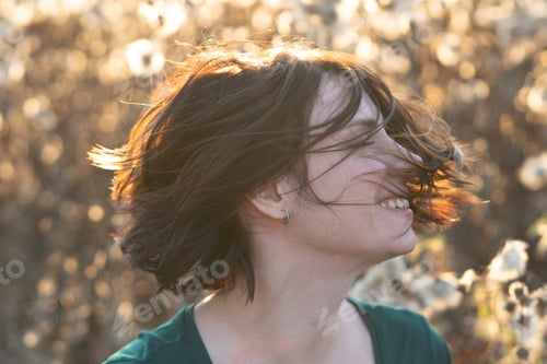 Preview: Portrait Of A Girl Shakes Her Head Standing In A Field