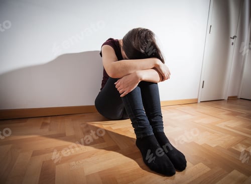 Preview: Depression Teenager Sitting On Floor In Empty Room