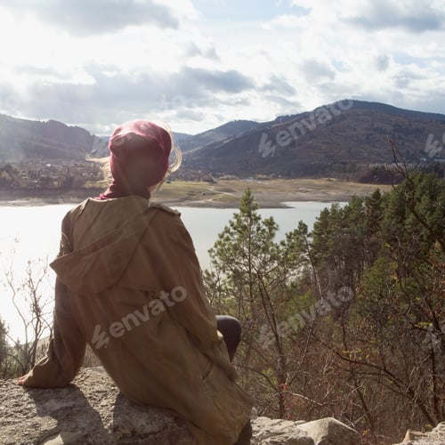 Preview: Girl Hipster Sits On The Background Of Romanian Carpathians Mountains
