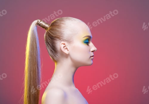 Preview: Woman with Elaborate Makeup and Ponytail Hairstyle