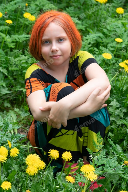 Preview: Little Girl Sitting On The Grass With Yellow Dandelions