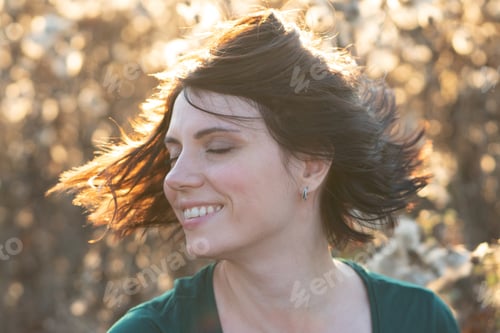 Preview: Portrait Of A Girl Shakes Her Head Standing In A Field