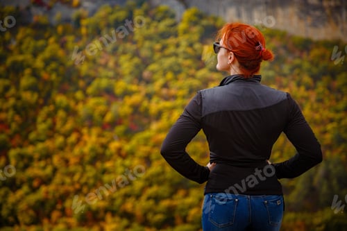 Preview: Red-Haired Elegant Lady With Closed Eyes Resting In Nature In The Mountains In The Meadow. Hiker
