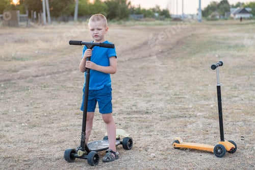 Preview: Happy Children With Their Father On A Walk In The Village. Boys Learn To Ride A Scooter On A Sunny