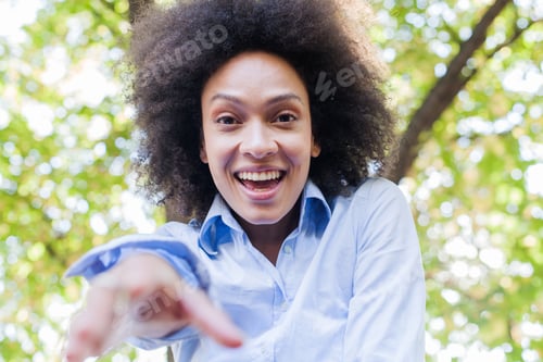 Preview: Portrait Of Happy Young Black Woman In Nature , Curly Hair, Beautiful Smile, Carefree Lifestyle