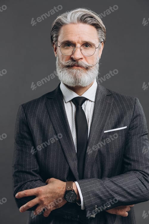 Preview: Portrait Of A Stylish And Fashionable Mature Man In A Gray Suit. Business And Trendy Close-Up