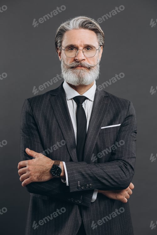Preview: Portrait Of A Stylish And Fashionable Mature Man In A Gray Suit. Business And Trendy Close-Up