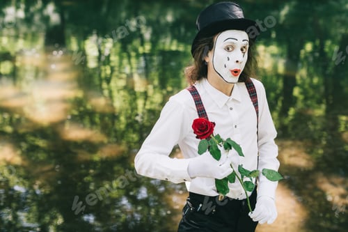 Preview: Funny Pantomime Gives A Red Rose On The Valentine Day.