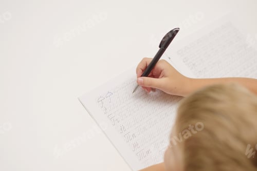 Preview: Little Boy Write In Exercise Book Homework