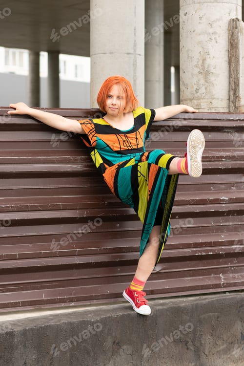 Preview: Little Girl Posing In A City Standing In A Colored Dress