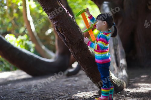 Preview: Young Girl Playing Outdoor Measure-Mate In The Forest Park For Leaning Measurement