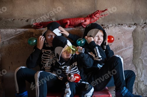 Preview: Happy Children In Carnival Costumes, Boys With A Red Crocodile In The Garage. Black Suit With The