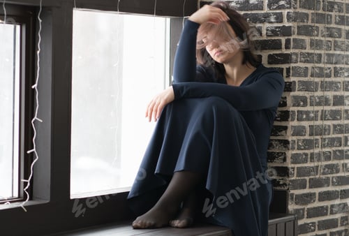 Preview: Young Beautiful Girl Sits On A Window In A Dress