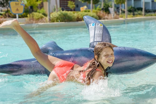 Preview: Girl Swimming And Falling Down In The Pool From An Inflatable Shark