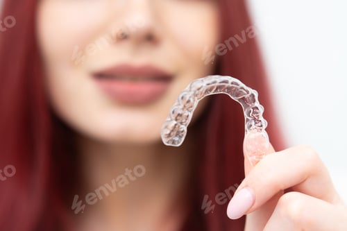 Preview: Woman With A Beautiful Smile Shows A Transparent Mouth Guard