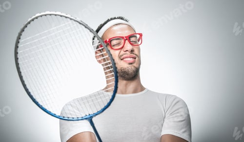 Preview: Close Up Funny Tennis Player Sport Man With Racket, Isolated On Gray Background. Facial Expression