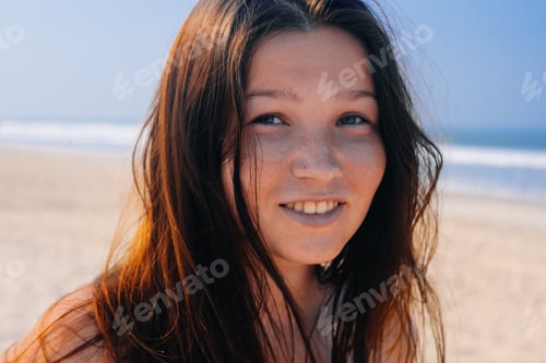 Preview: Smiling Beautiful Woman Sunbathing On A Beach
