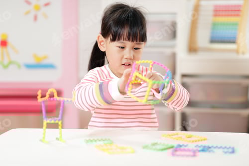 Preview: Young Girl Playing Creative 3D Shape Toy For Homeschooling
