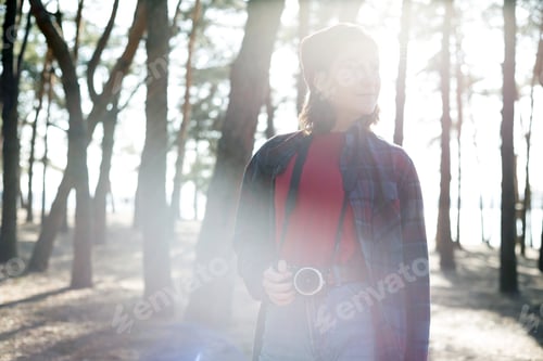 Preview: Beautiful Stylish Girl Holding A Camera In The Forest. Wild Conditions