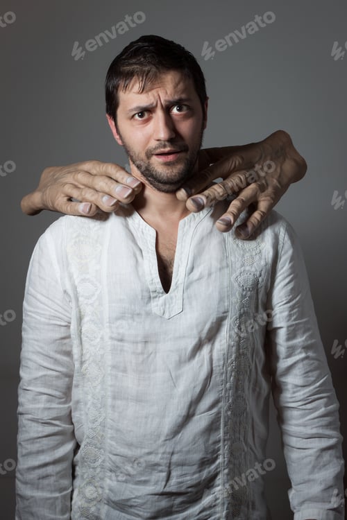 Preview: Young Bearded Man Choked By Two Huge Hands On Dark Background