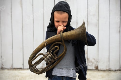 Preview: A Young Guy Plays With A Musical Instrument And A Prize For Races On A Rural Farmstead In A Hot