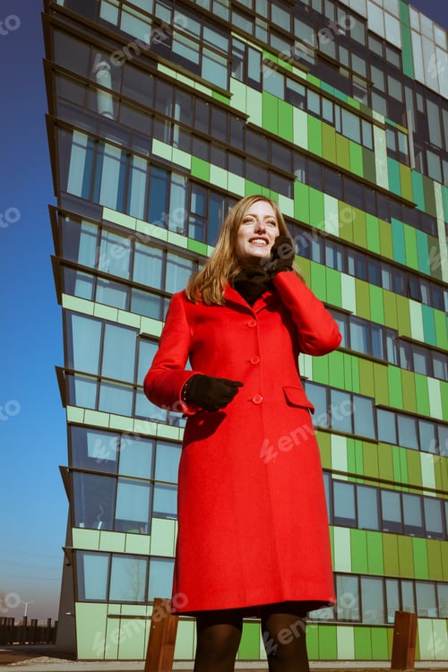 Preview: Beautiful Girl With Red Coat Talking On Phone In The Street