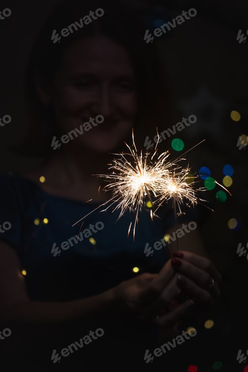 Preview: Girl Holds Bengal Lights - Happy Christmas And Merry Holidays