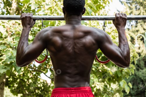 Preview: Athletic Black Man Doing Workout In A City Park. Concept Of Healthy Lifestyle.