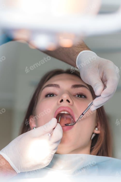 Preview: The Doctor Examines The Oral Cavity Of The Patient
