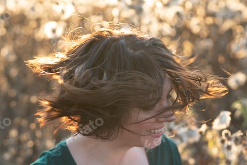 Preview: Portrait Of A Girl Shakes Her Head Standing In A Field
