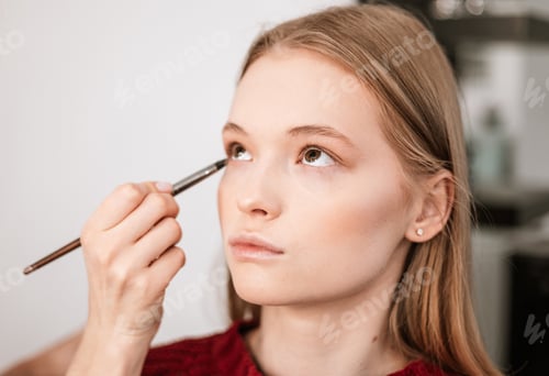 Preview: Makeup Artist Applies Eye Shadow To The Eyelids On A Beautiful Young Woman Blonde Model, Face Make