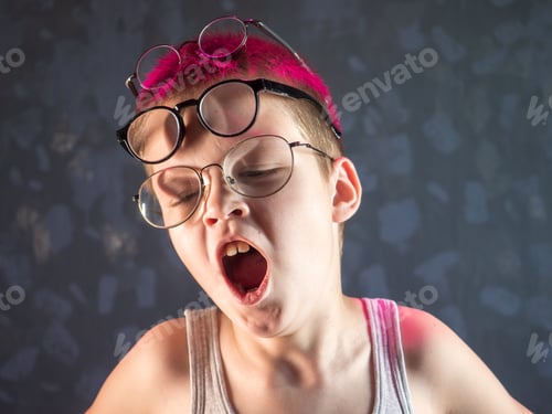 Preview: Photo Of Funny Boy, Blonde Kid With Lot Of Pairs Of Glasses On His Face. Child Is Happy At Home On