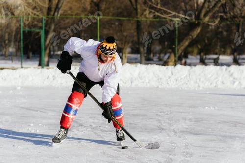 Preview: Man In Ice Skates Plays In Hockey At The Stadium