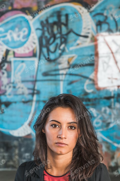 Preview: Beautiful Young Brunette With Long Hair Posing In An Urban Context