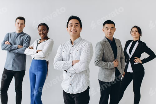 Preview: Cheerful Multiracial Professional Business People Laughing Together Standing In Row Near Wall