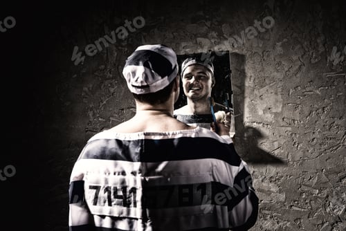 Preview: Prisoner Wearing Prison Uniform With Sewed Number Standing With Toothbrush And Looking At His