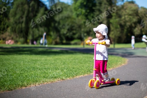 Preview: Baby Girl Play Balance Scooter At Summer Park