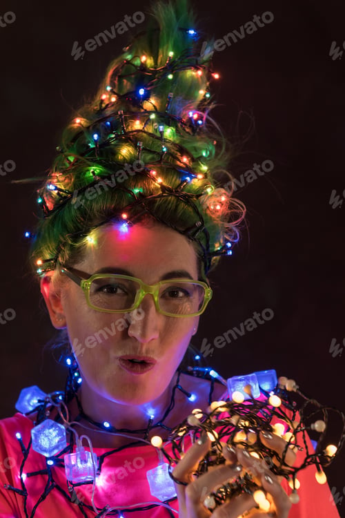 Preview: A Beautiful Girl In A Pink Dress With Green Hair Decorated Herself With Christmas Garlands. Her