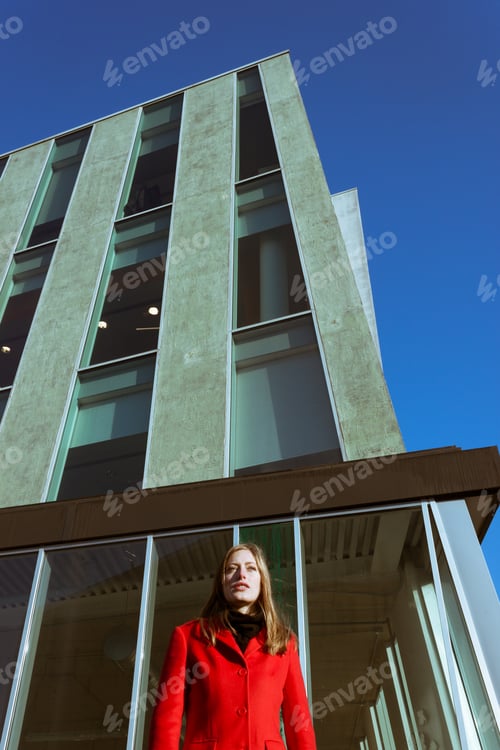Preview: Beautiful Girl Posing In The Street With Red Coat