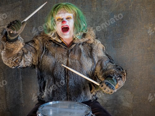 Preview: Crazy Aggressive Clown In Wolf Skin Plays Drum. Man Hates His Work In His Free Time, Dresses Like