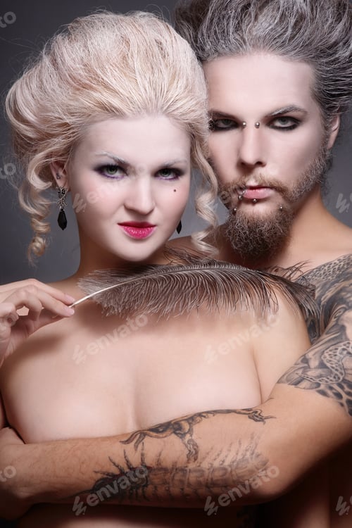 Preview: Portrait Of Pierced Tattooed Man And Woman With Old-Fashioned Make-Up And Hairstyle