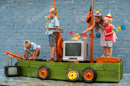Preview: Happy Brothers-Boys In Colored Clothes And Girl Celebrate Birthday Of Youngest Boy On Pirate Ship