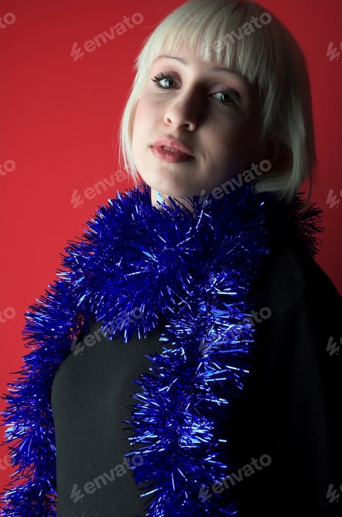 Preview: Attractive Blond Girl On Red Background.